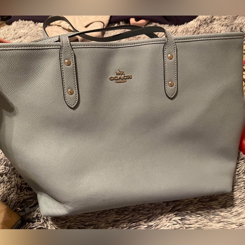 Light blue coach purse with matching wallet.